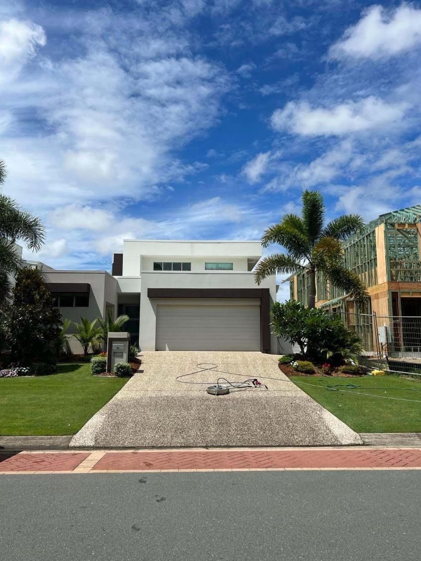 A House With A Garage And A Driveway In Front Of It— Supercare Gold Coast in Miami, QLD