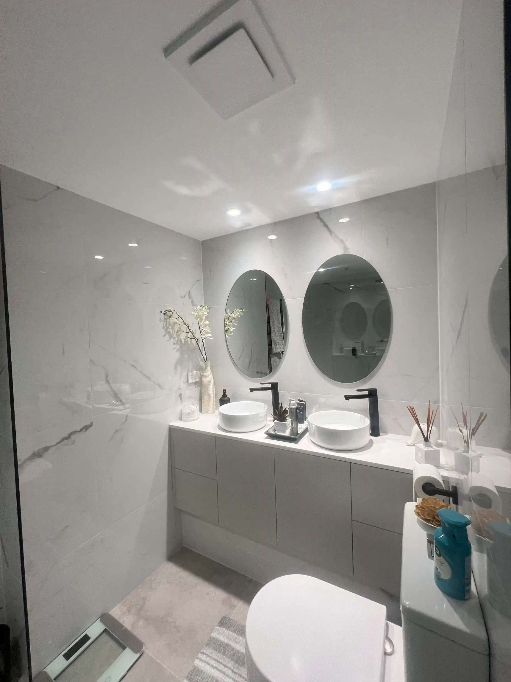 A Bathroom With Two Sinks, A Toilet, And Two Mirrors — Supercare Gold Coast In Miami, QLD