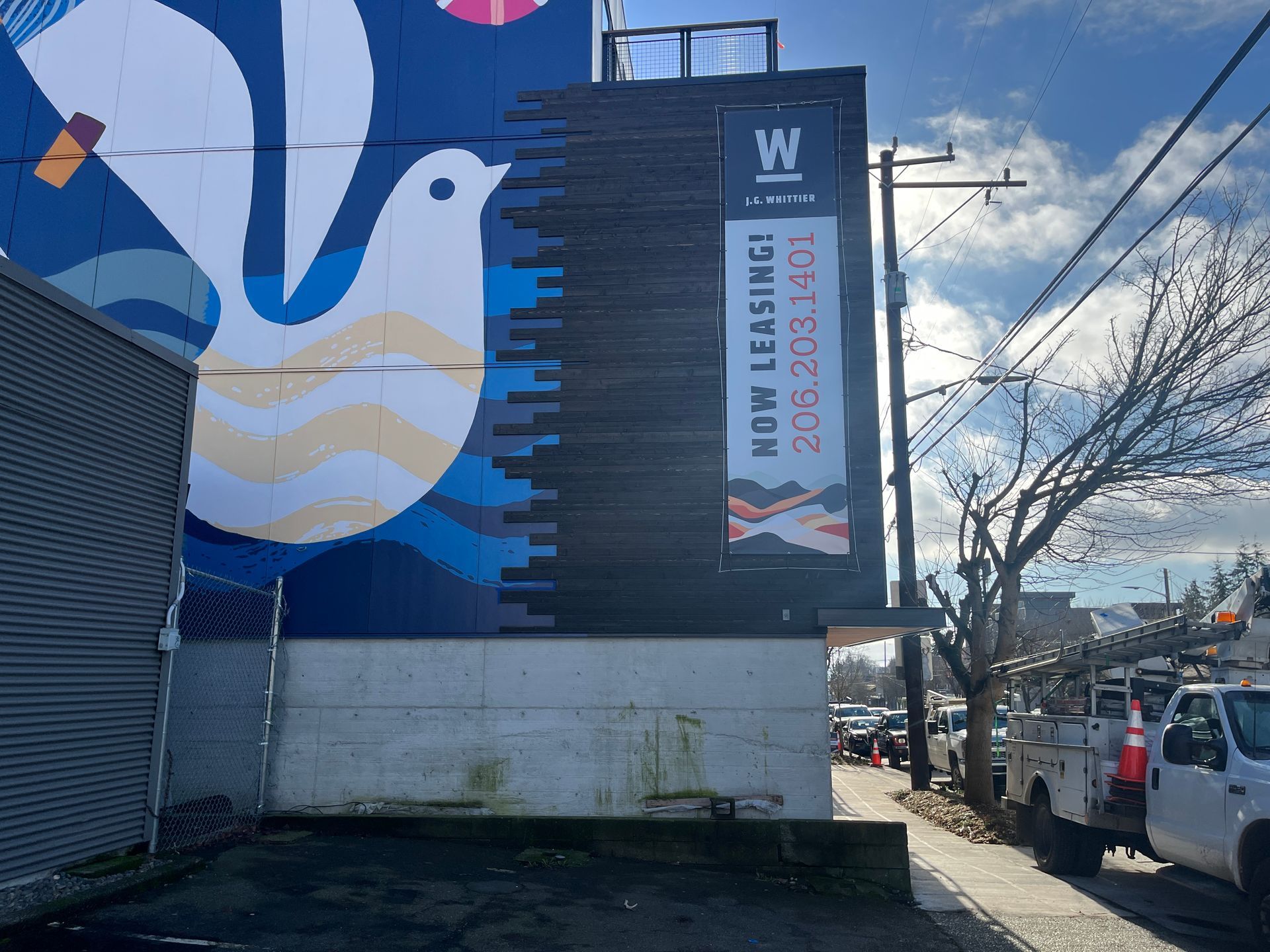 Mural of a dove on blue building