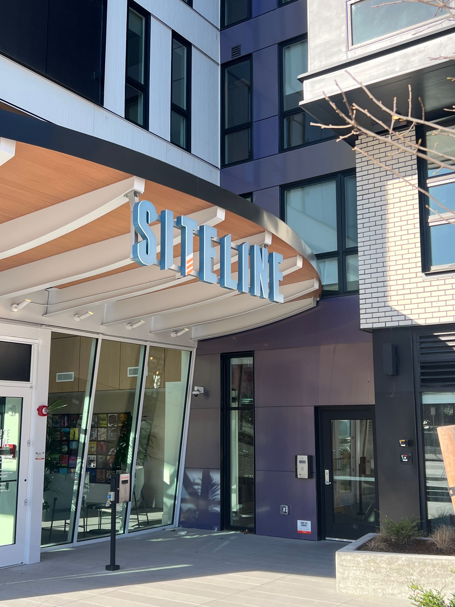 Entrance to building with blue signage