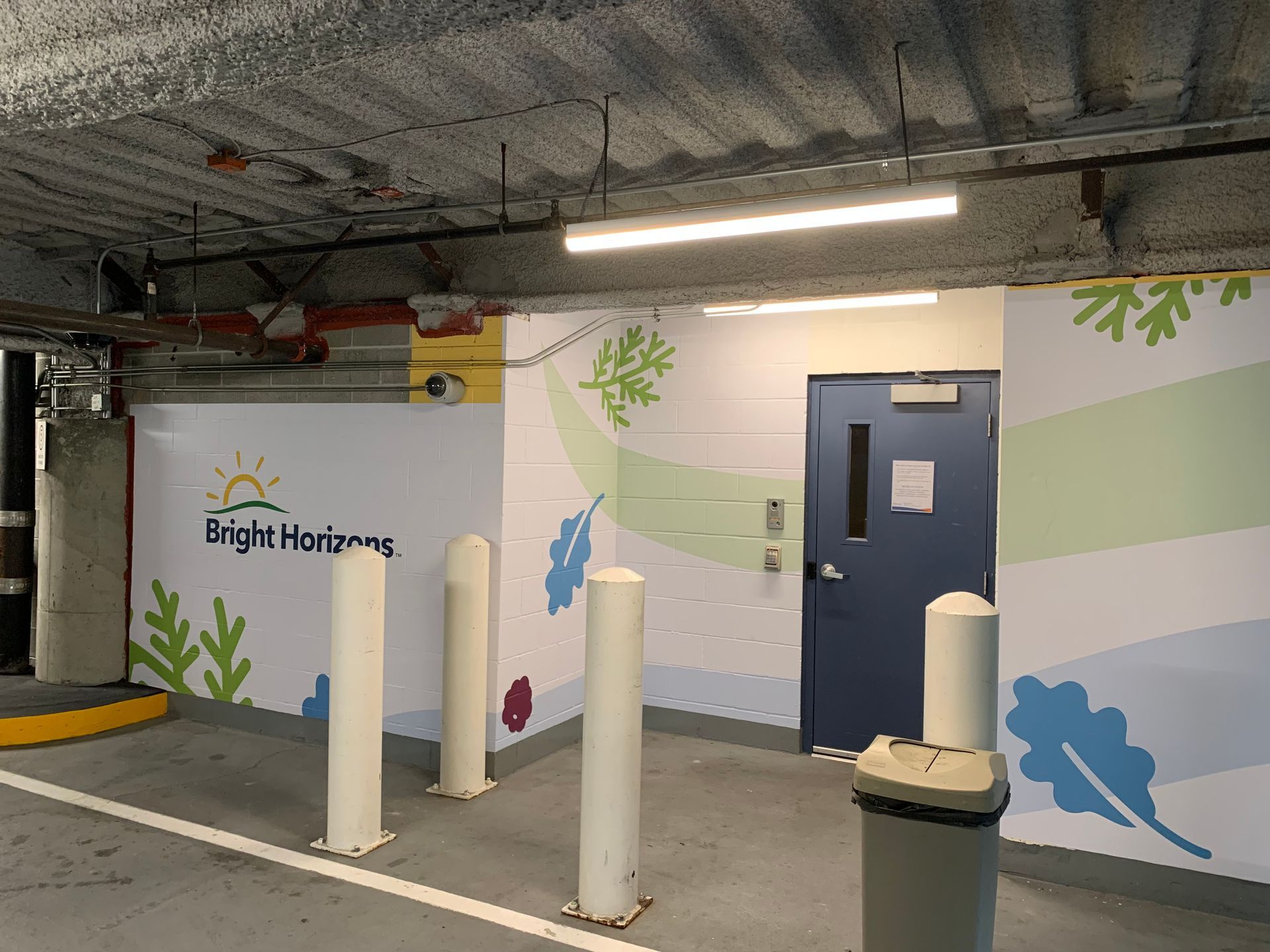 Parking garage entrance with white pillars