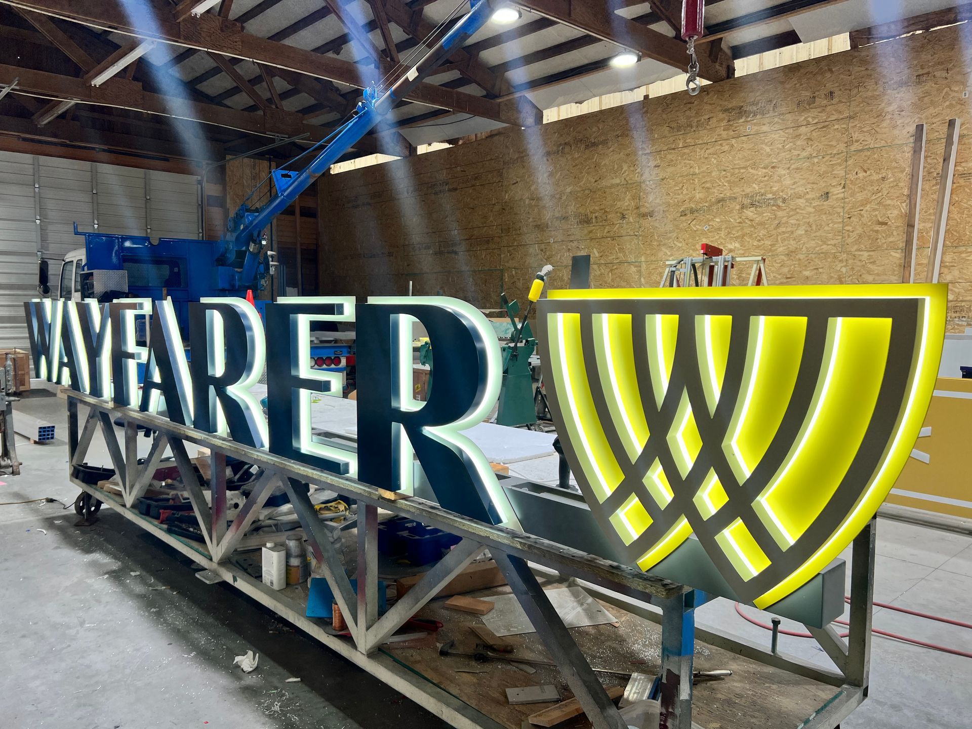 Illuminated sign in a workshop