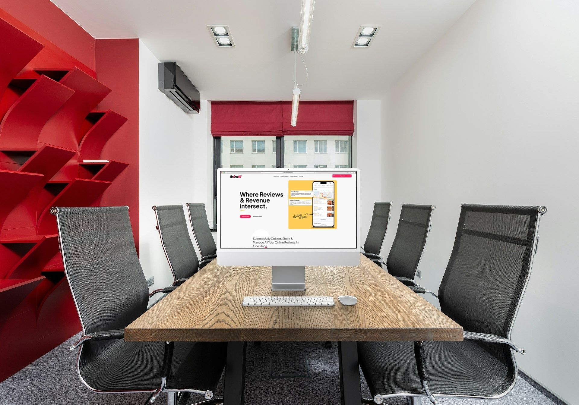 A conference room with a table and chairs and a computer on it