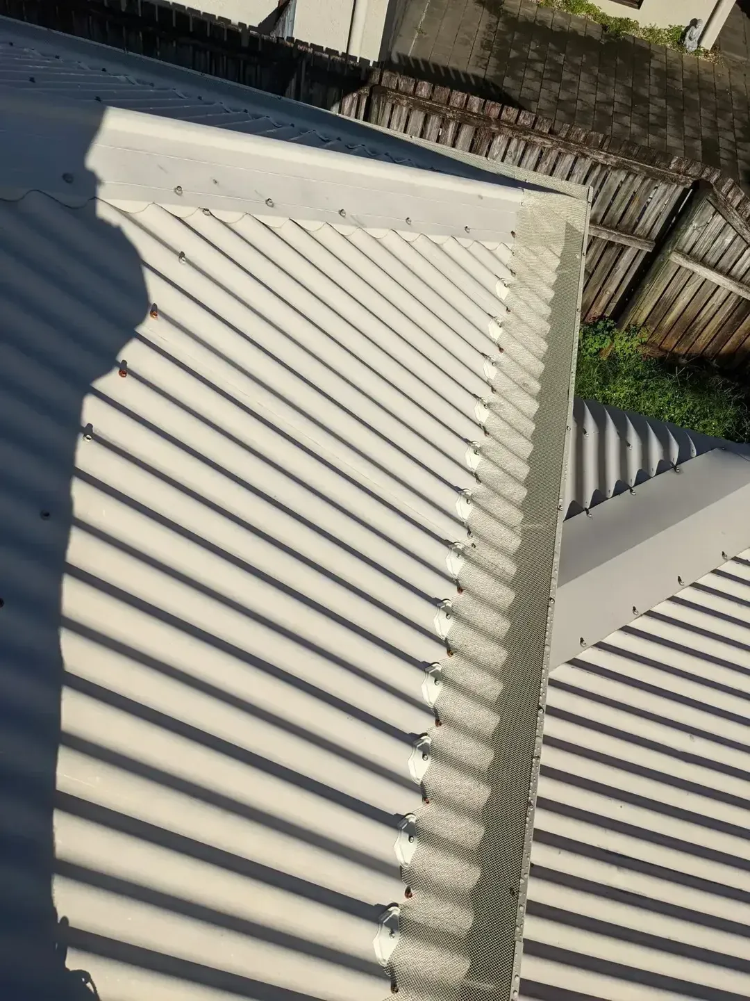 A Close up Of a Roof with A Shadow on It — All-Clear Gutter Guard NQ in Cairns, QLD