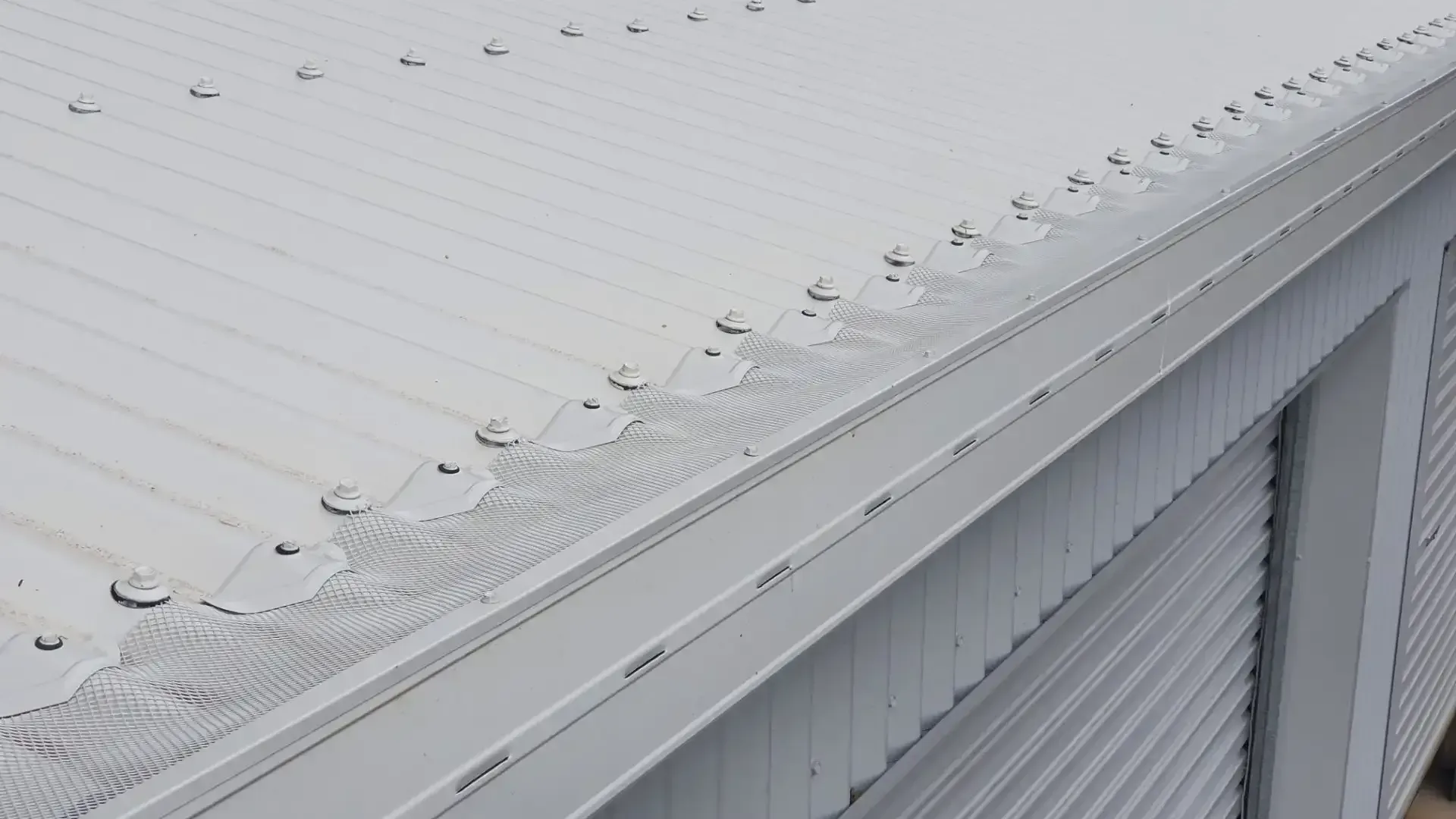 A White Roof with A Gutter on The Side of A Building — All-Clear Gutter Guard NQ in Cairns, QLD
