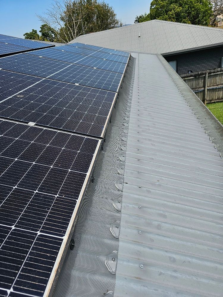 There Are Many Solar Panels on The Roof of A House — All-Clear Gutter Guard NQ in Cairns, QLD