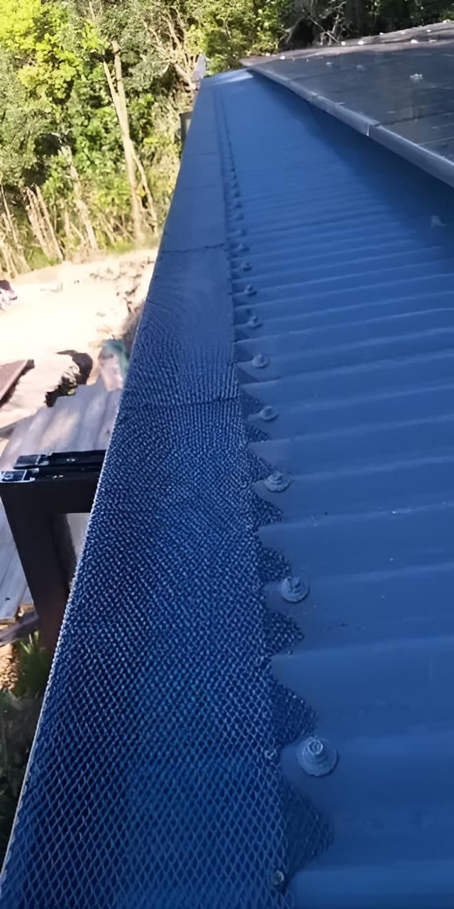 A Close Up of a Blue Roof With a Gutter on It — All-Clear Gutter Guard NQ in Cairns, QLD