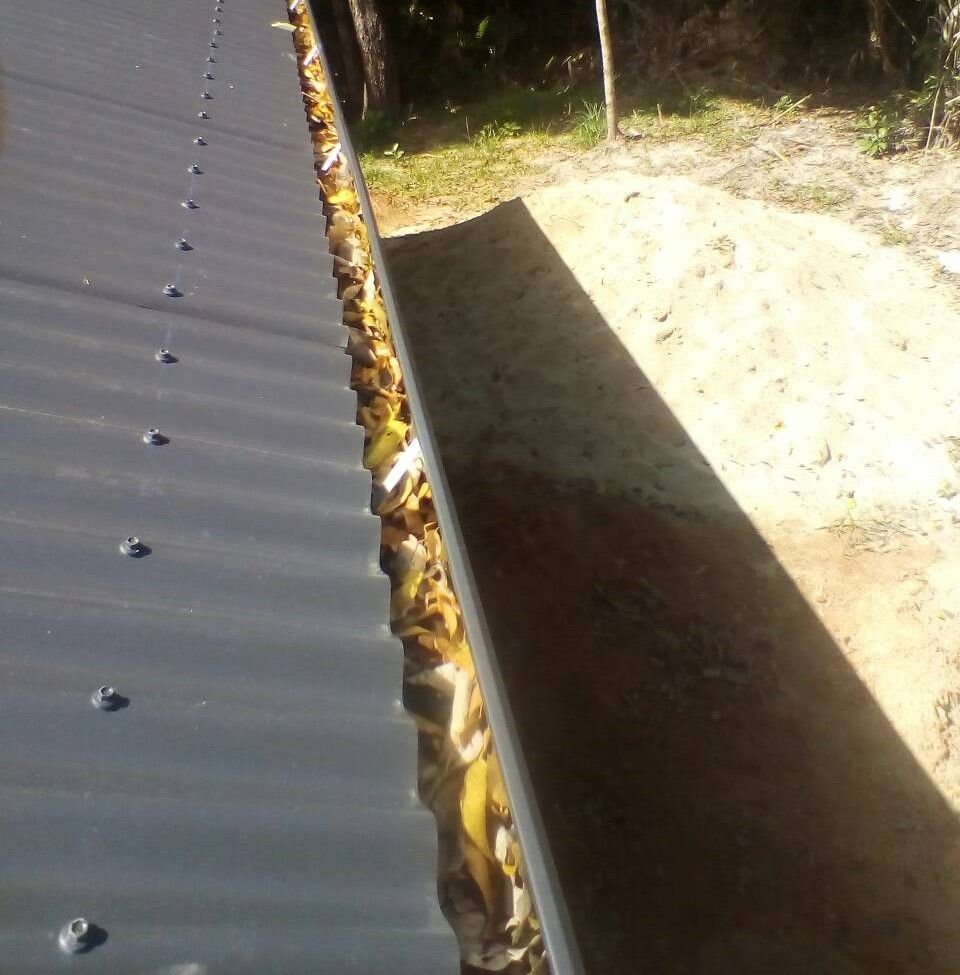 A Gutter With A Lot Of Leaves On It — All-Clear Gutter Guard NQ in Cairns, QLD