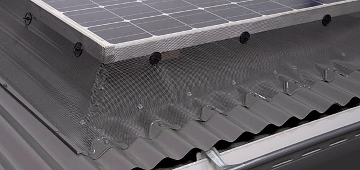 A Solar Panel Is Sitting on Top of A Metal Roof — All-Clear Gutter Guard NQ in Cairns, QLD