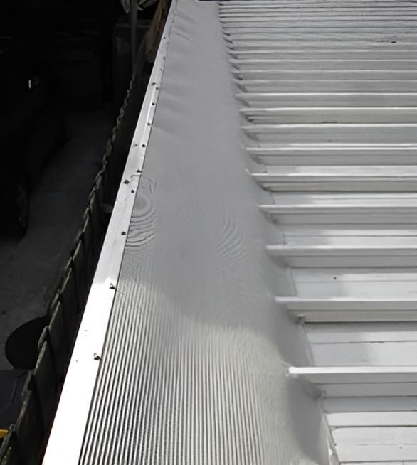A Close Up of a White Roof With a Metal Gutter — All-Clear Gutter Guard NQ in Cairns, QLD