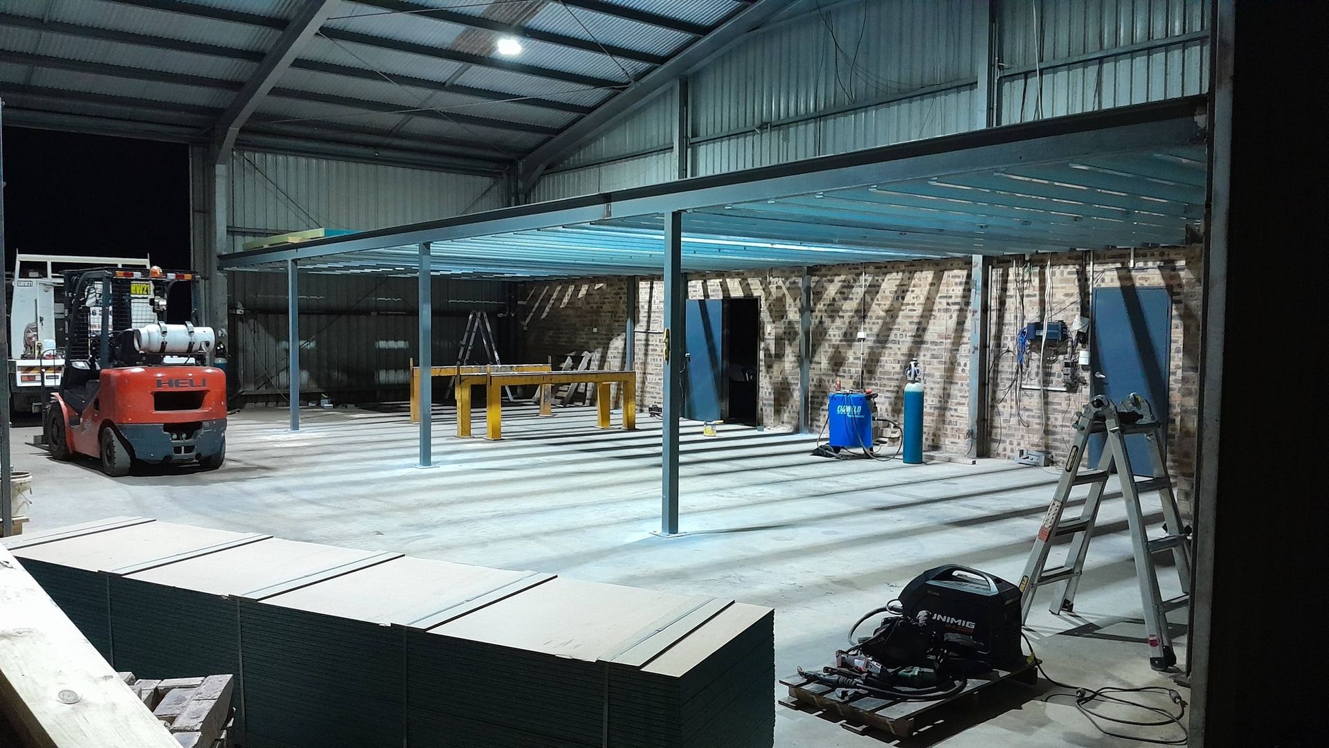 Man Is Standing In Front Of Two Monitors In A Factory — Vids Fabrication in South Lismore, NSW