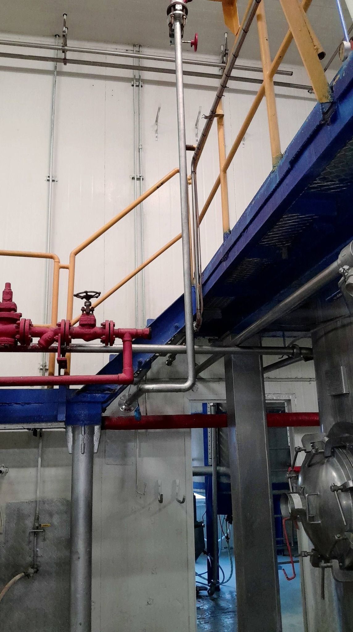 A Stainless Steel Tank With A Metal Cage — Vids Fabrication in South Lismore, NSW