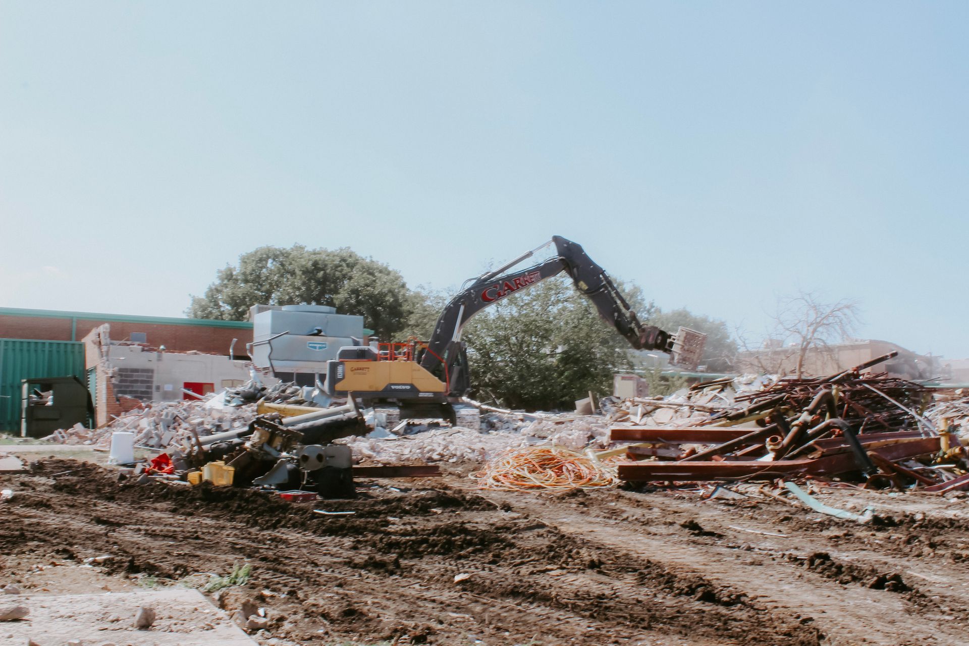 A large excavator is working on a construction site.