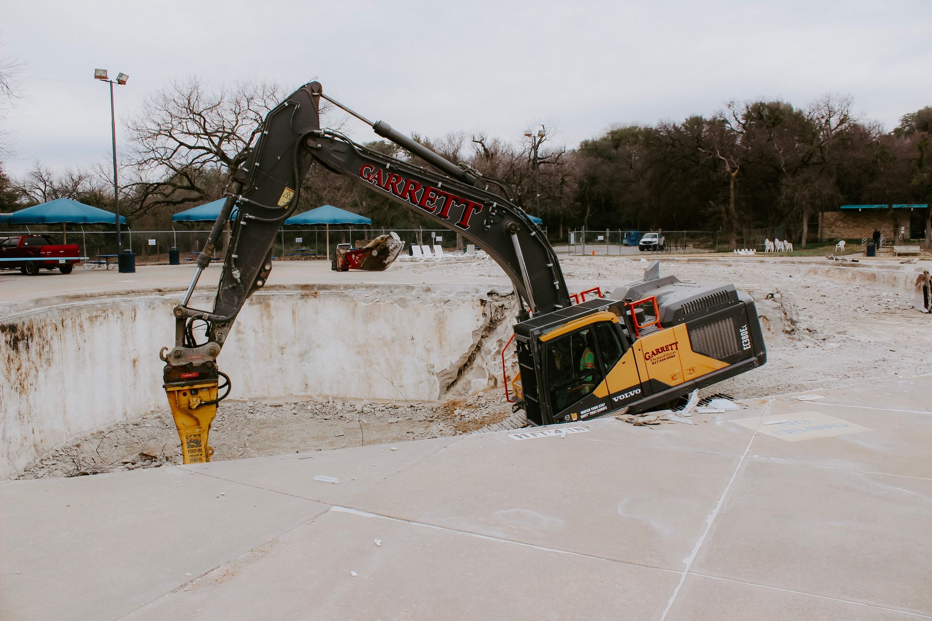 A large excavator is digging a hole in the ground.