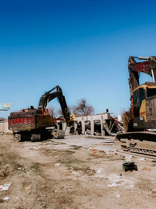 A bulldozer is being used to demolish a building.