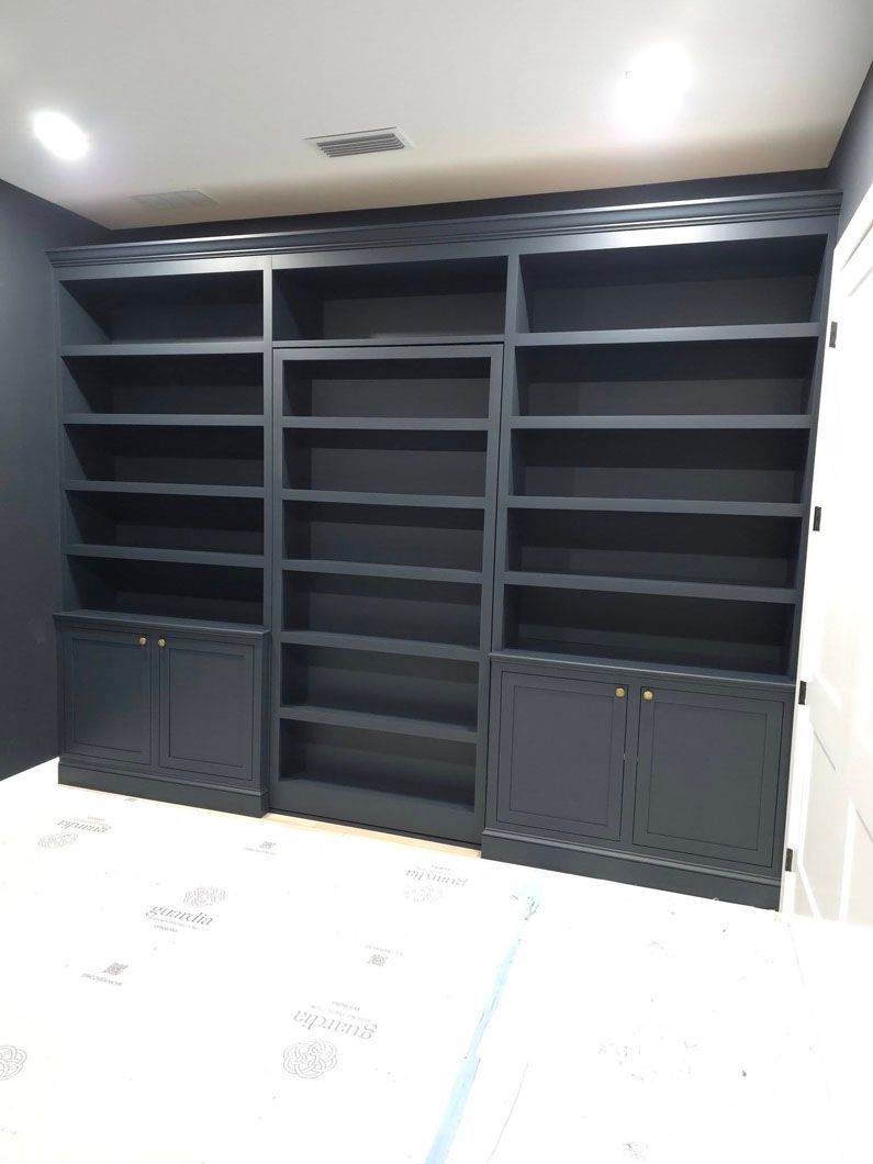 A room with a lot of shelves and cabinets