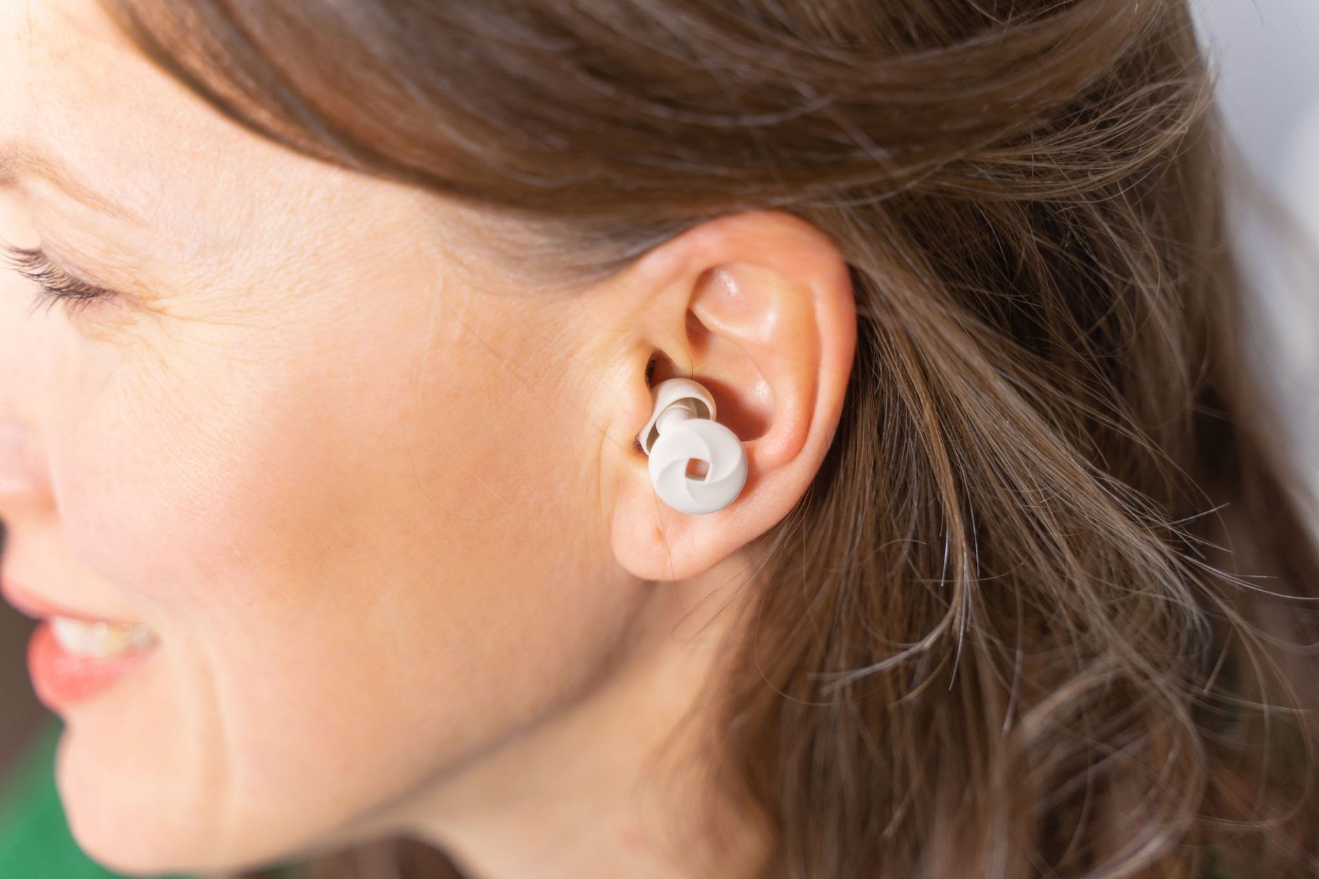 Discreet earplugs soften harsh decibels without blocking out your kids entirely.. Source: Happycity21 / Getty Images
