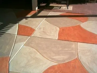 A concrete floor with a geometric pattern on it.