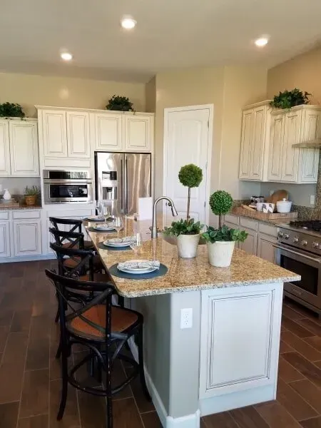A kitchen with a large island and stainless steel appliances.