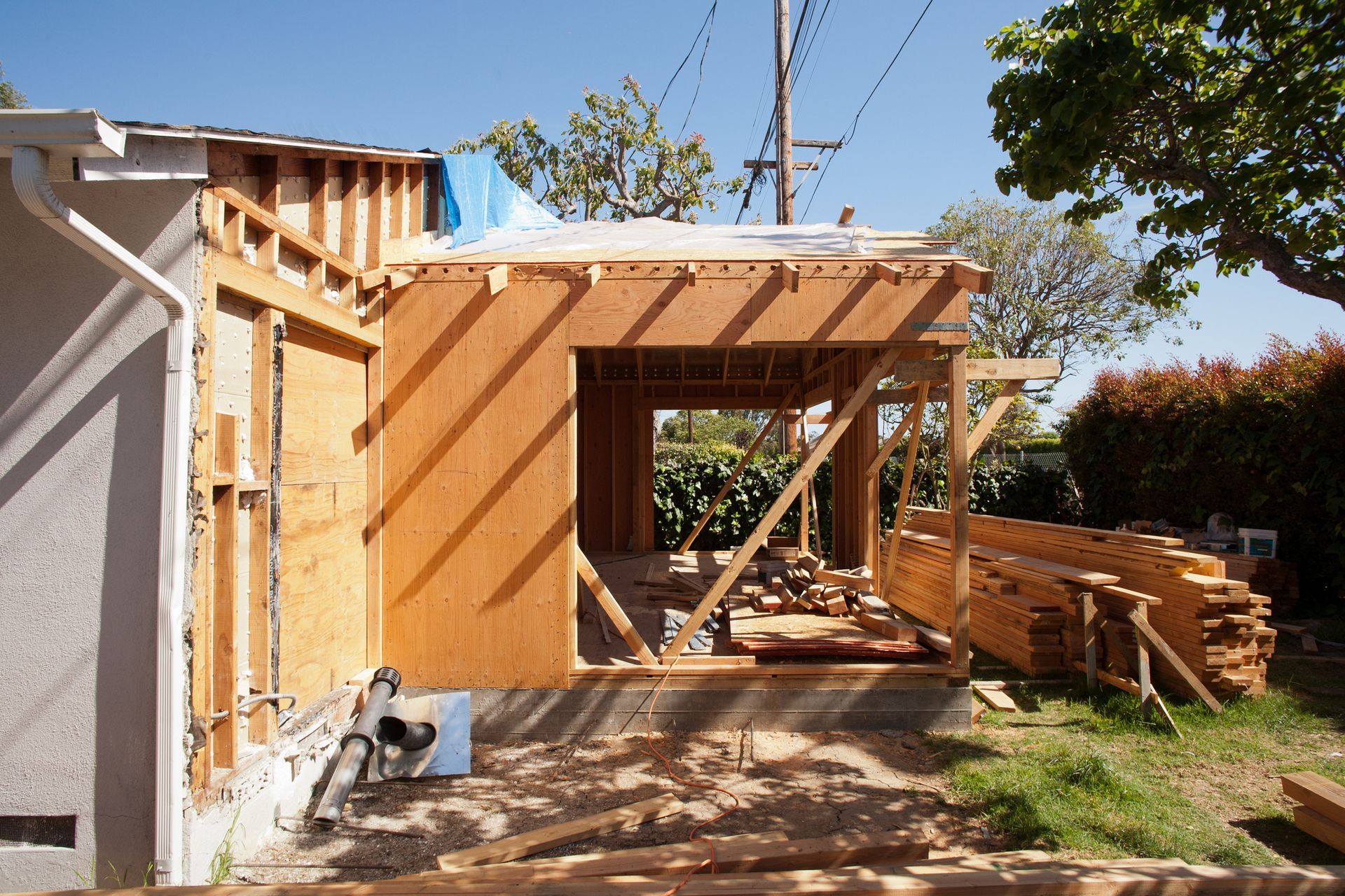 A house that is being built with a lot of wood.