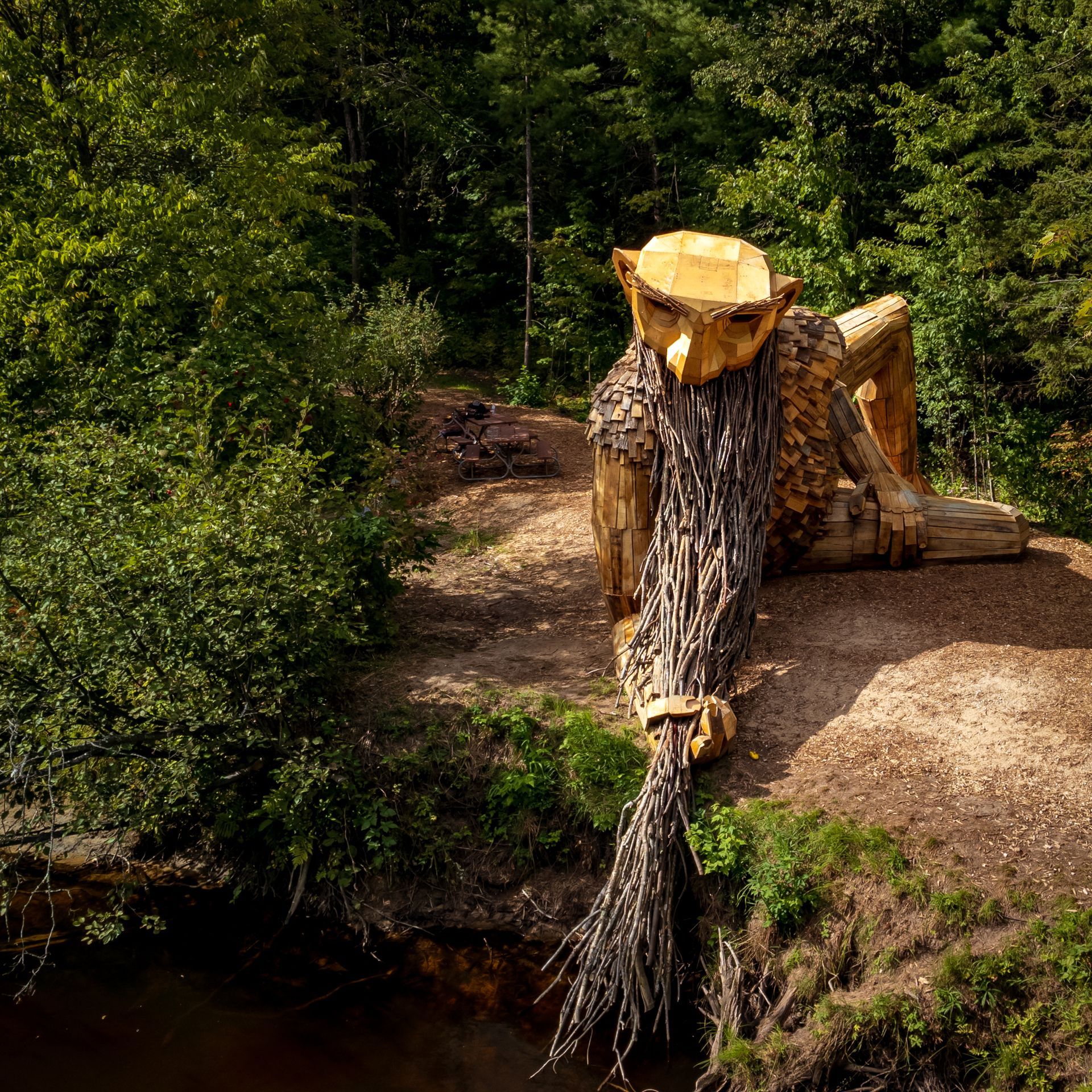 a large wooden statue of a man with a long beard