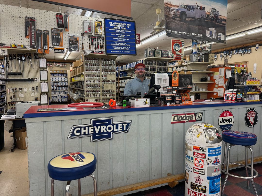 A man is behind a counter in a chevrolet store