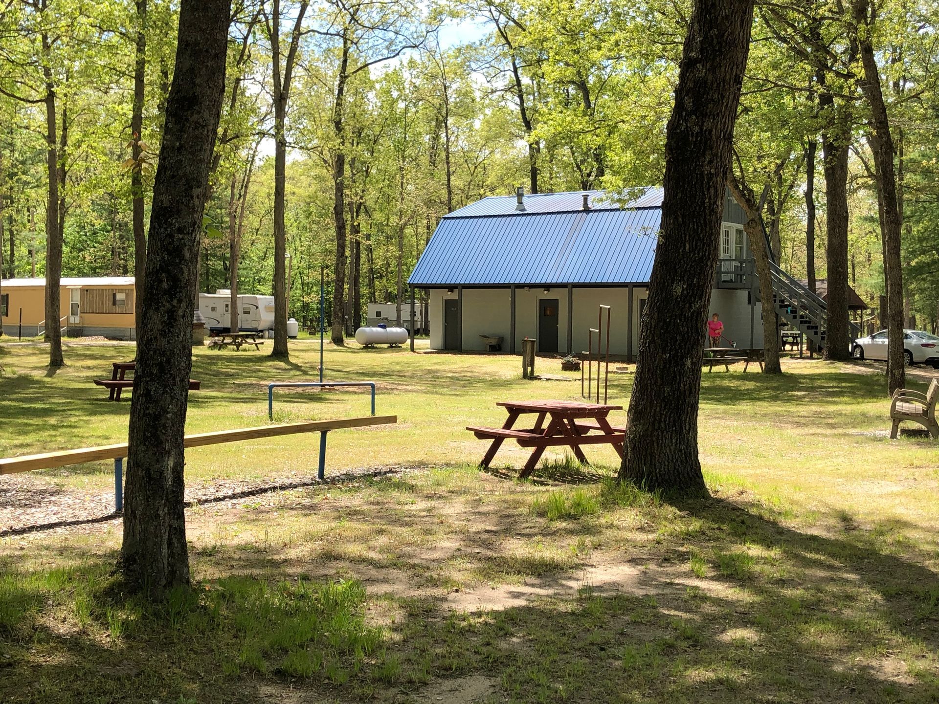 There is a picnic table in the middle of the park.