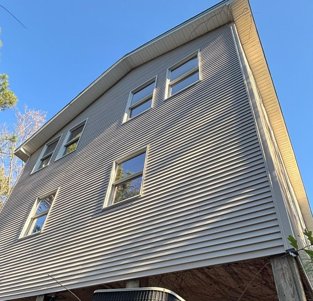 Looking up at a house with a blue sky in the background