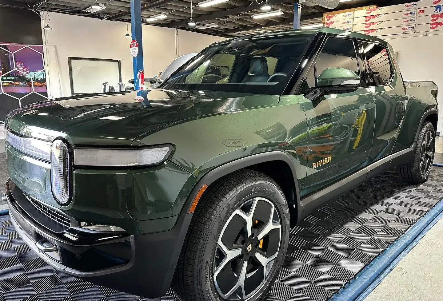 A green car with ceramic coating that helps car paint oxidation