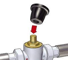 a drawing of a temepring valve being removed from a pipe 