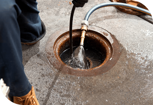 plumber unblocking a blocked drain in Black Forest