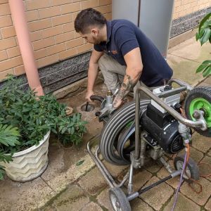 Plumber Paradise uses a snake to locate a blockage in a drain
