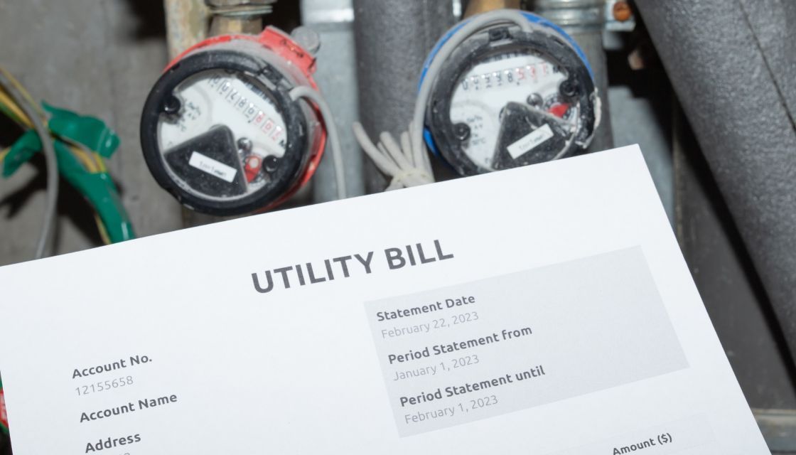Water bill in front of two water meters.