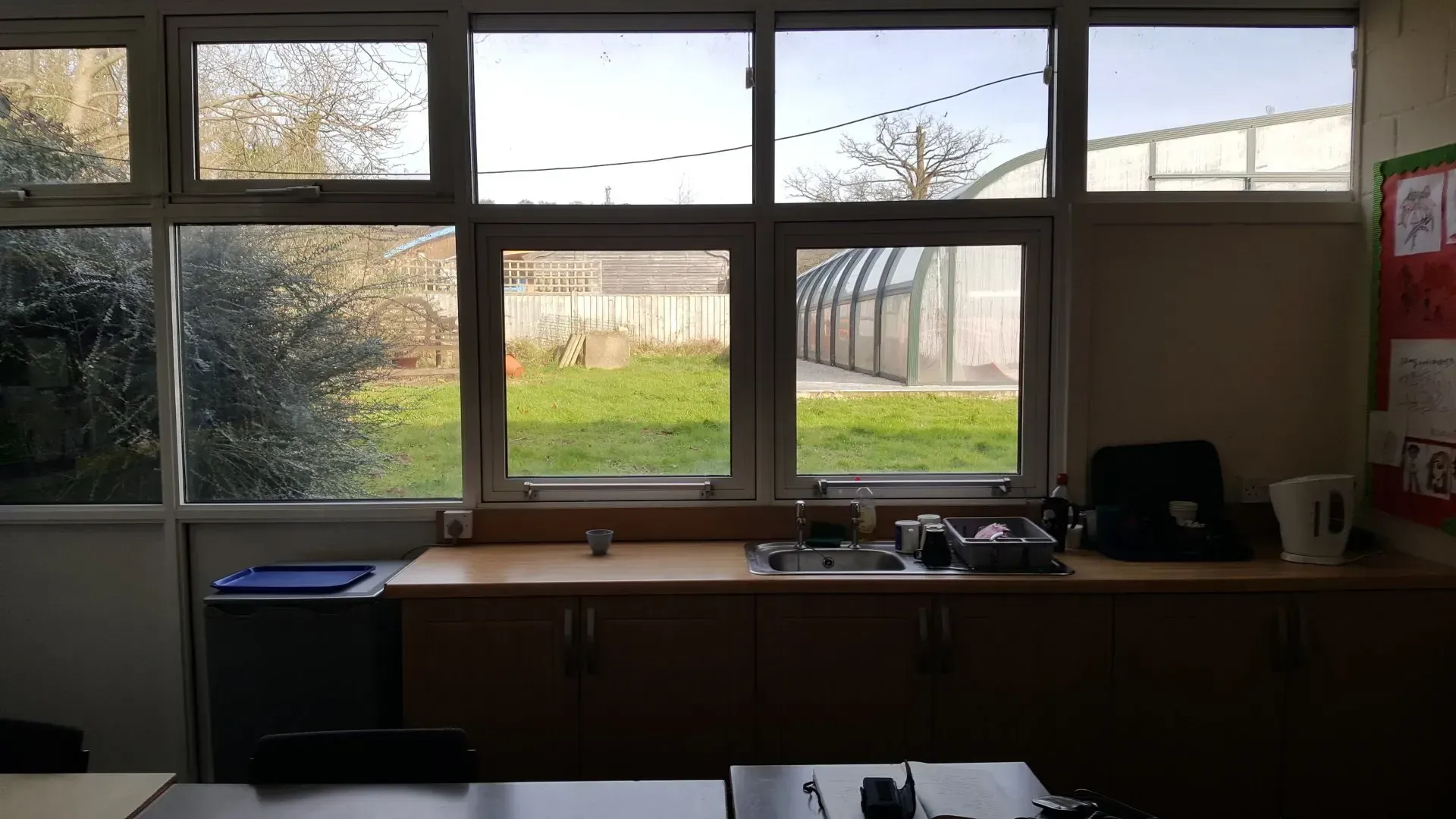 a kitchen with a sink and a lot of windows