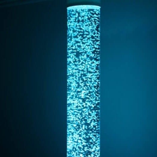 A glowing, cylindrical bubble tube light fixture emitting a bright blue light against a dark blue background.