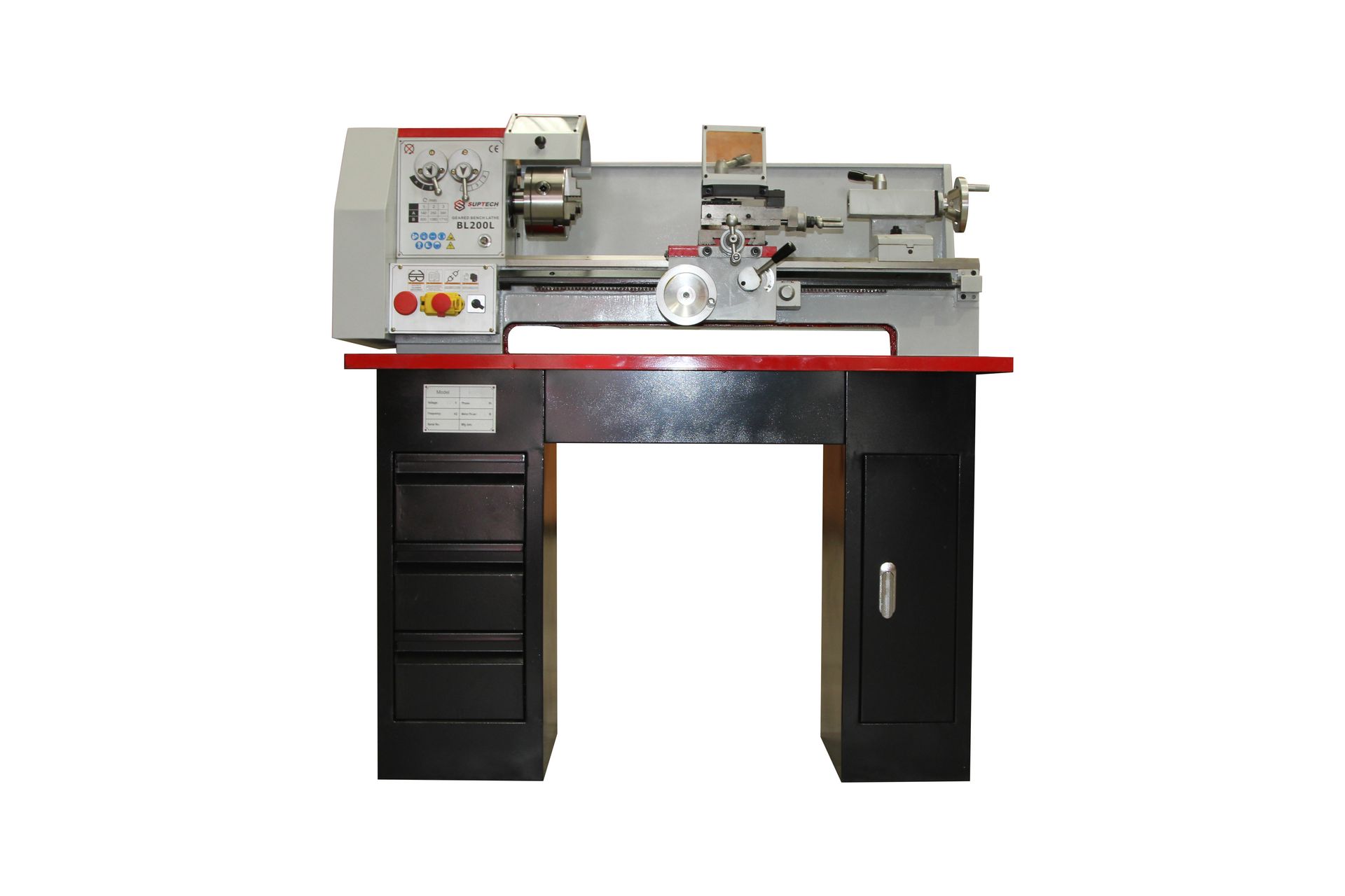 Metal lathe on a black workbench in a workshop, with drawers below and tools mounted above