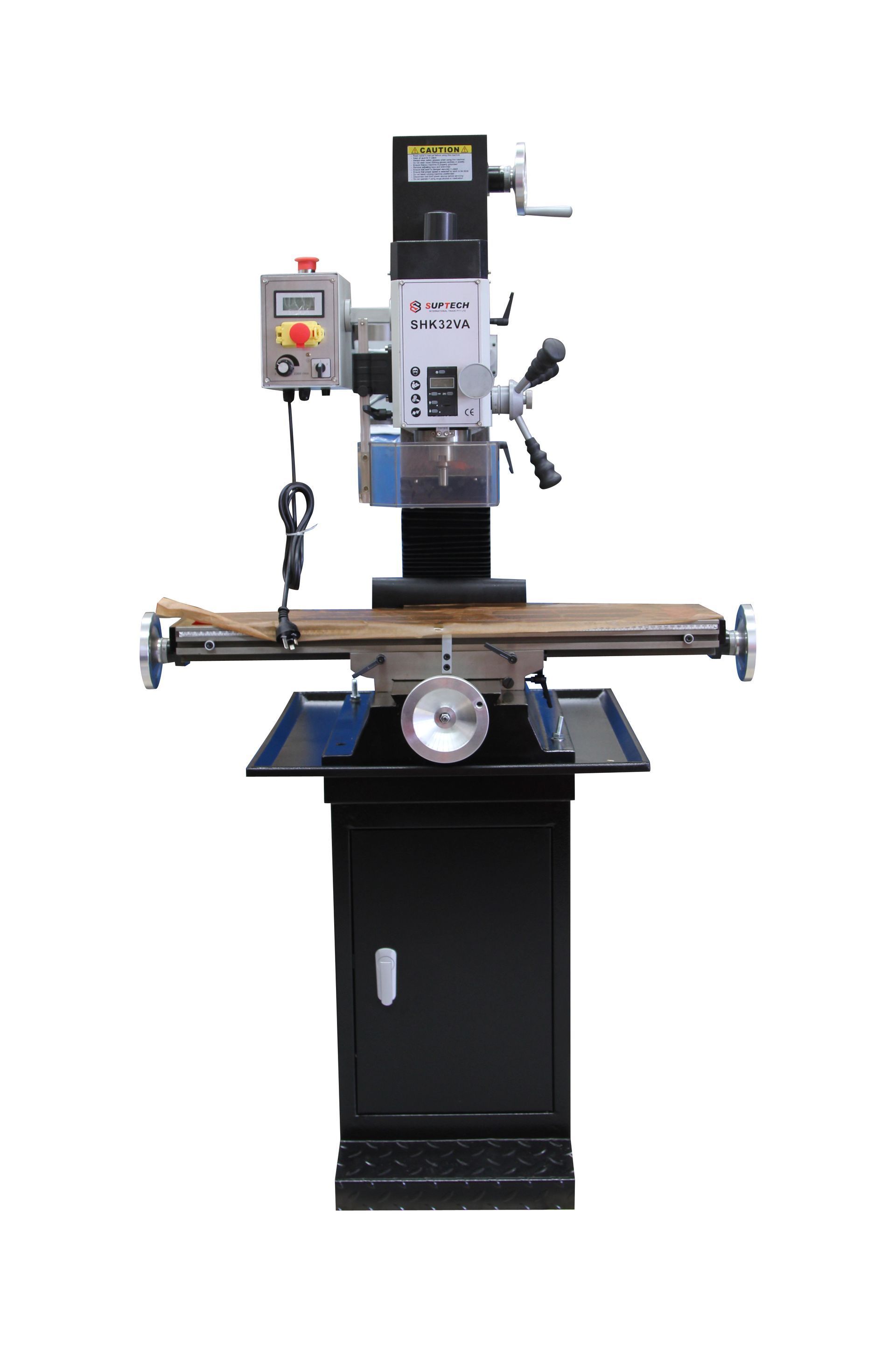 Industrial drill press with a worktable and attached control panel, mounted on a black base.