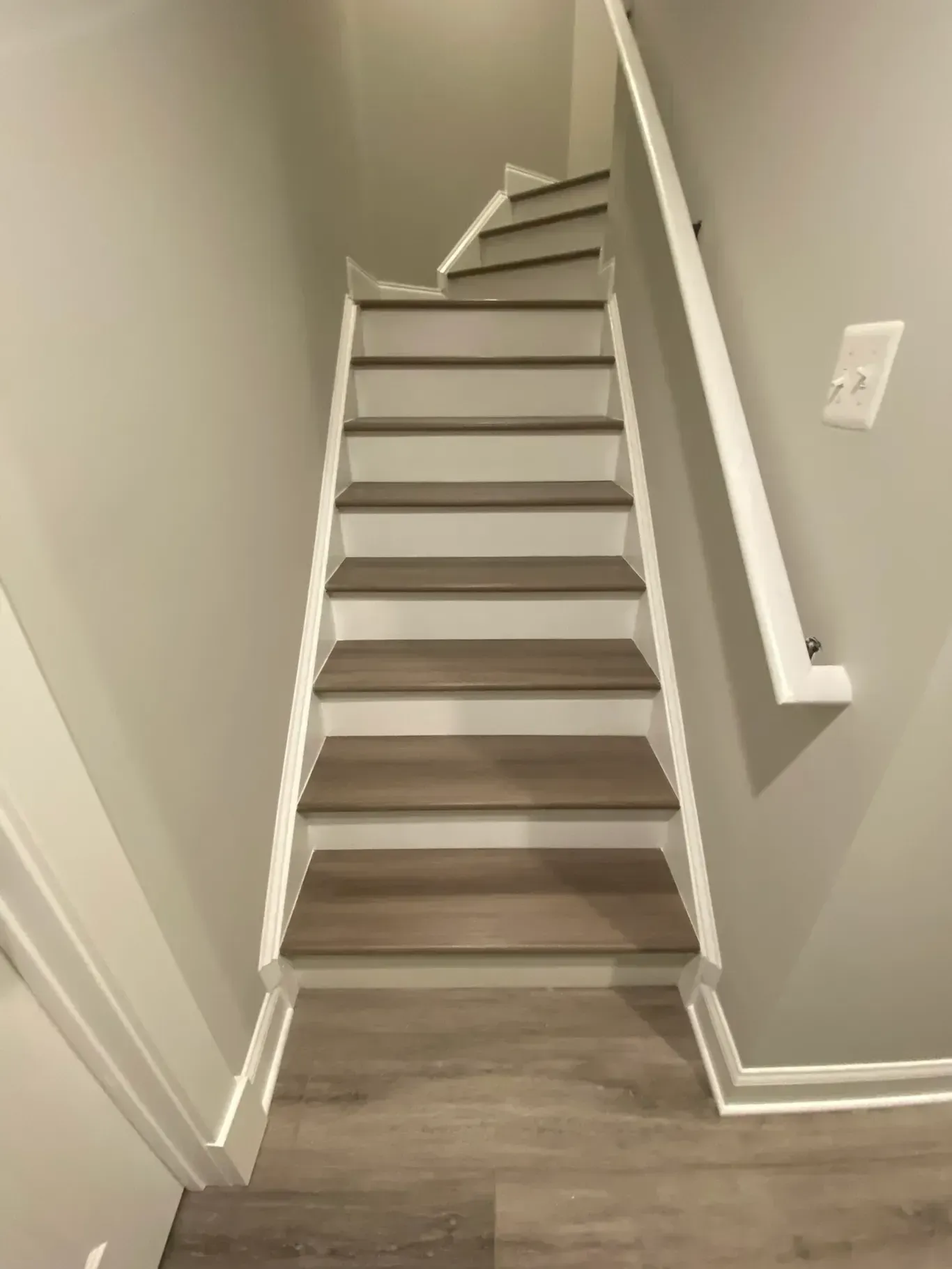 A set of stairs leading up to the second floor of a house.