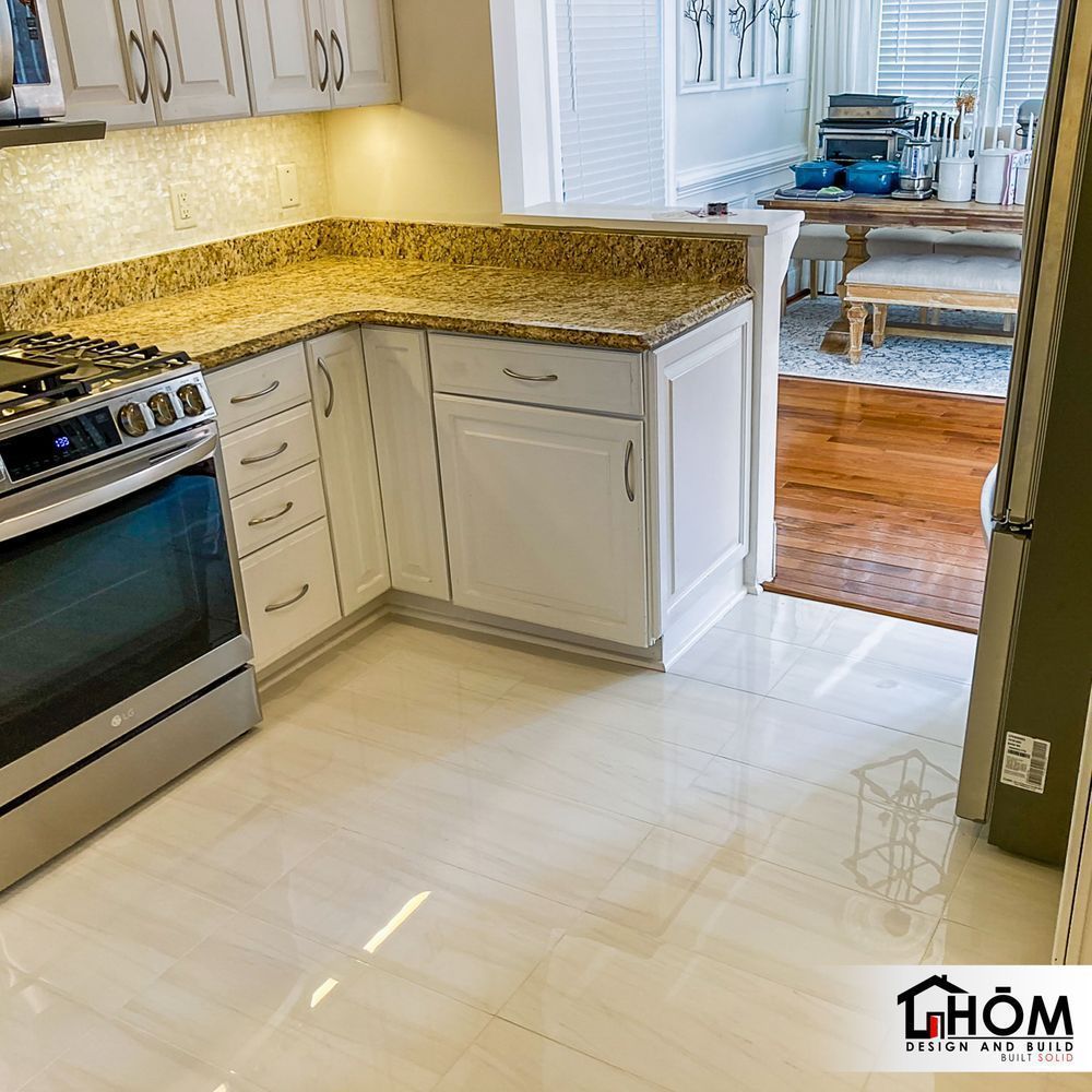 A kitchen with stainless steel appliances and granite counter tops
