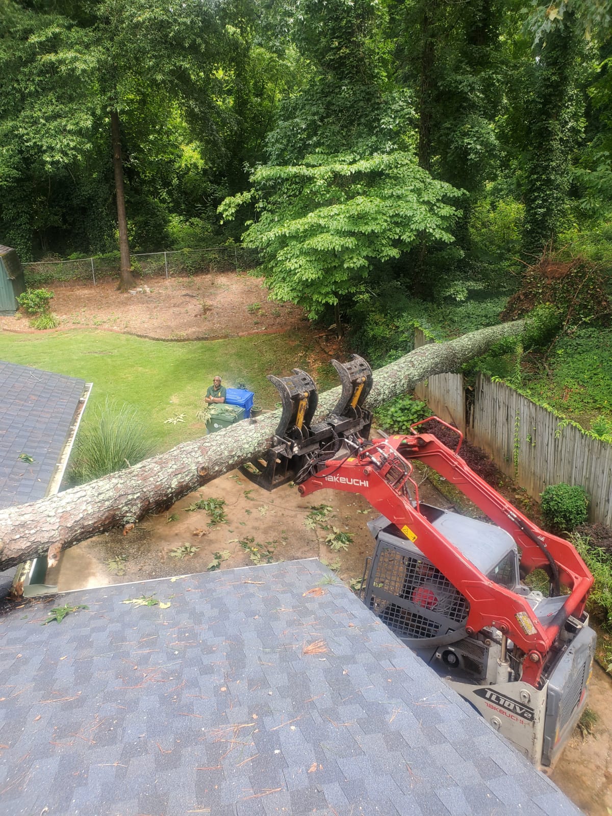 Using heavy machines to remove tree trunk