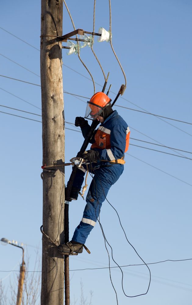 Utility Worker on a Pole Repairing Overhead Power Lines — Diverse Power In Berkeley Vale, NSW