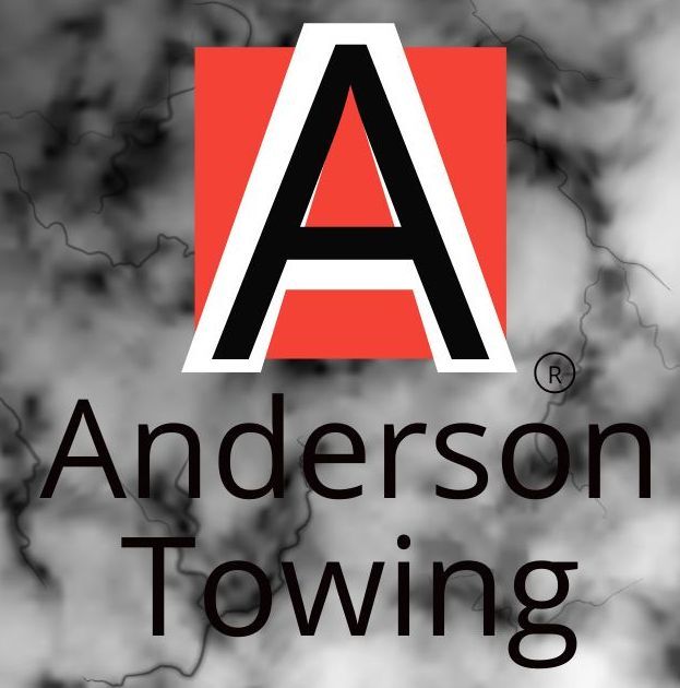 A logo for anderson towing with a red square in the middle