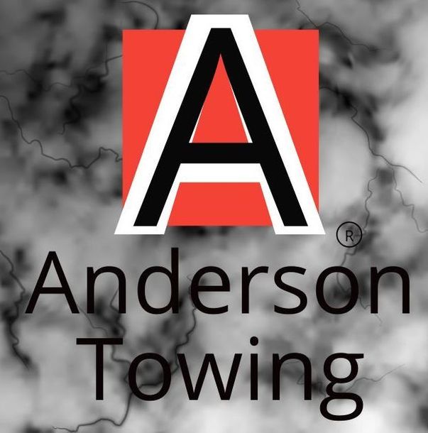 A logo for anderson towing with a red square in the middle