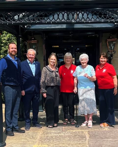 Heartbeat members presenting a defibrillator to Norden Cricket Club