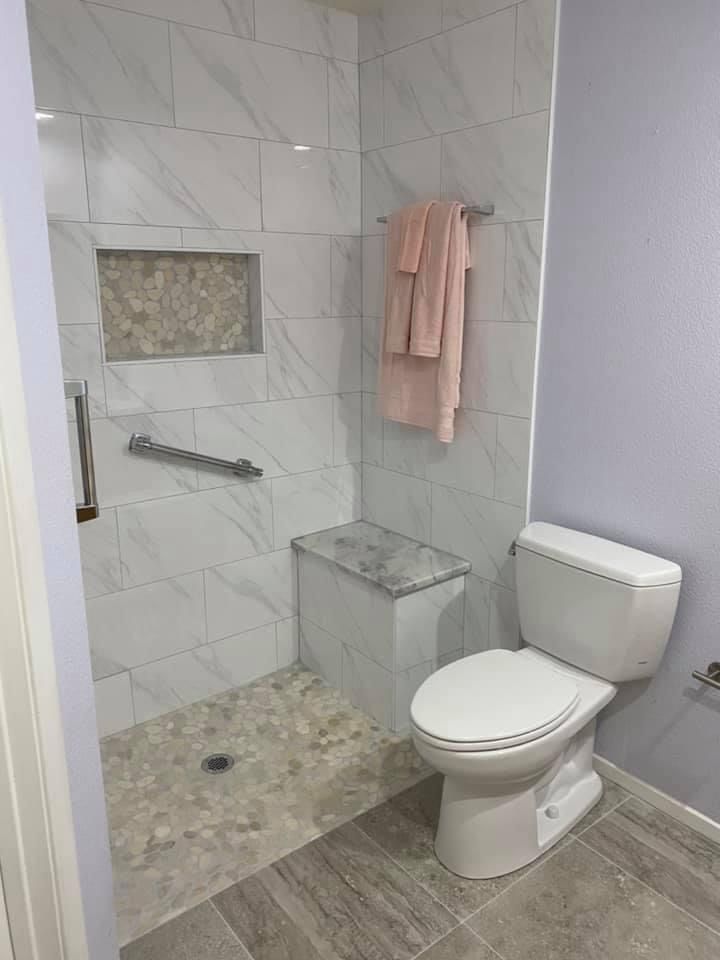 Bathtub shower was converted into a  curbless shower. 