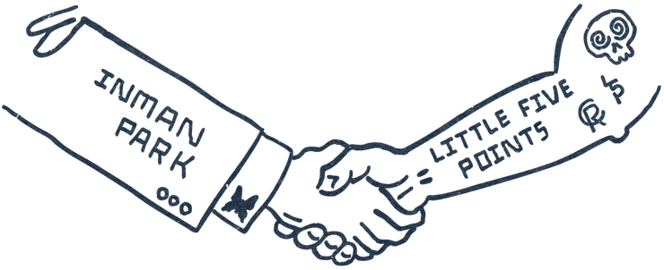 A handshake between a person wearing a suit labeled