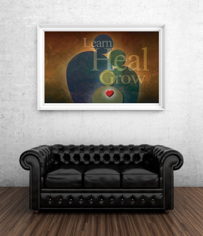A black couch in front of a framed poster that says learn heal grow