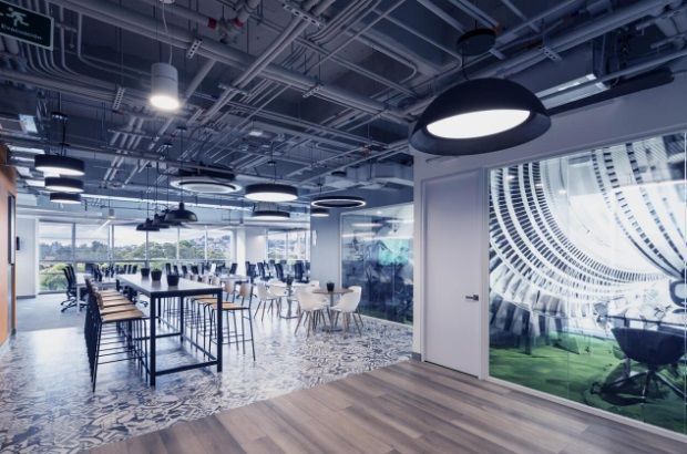 A large room with a dining table and chairs in it.