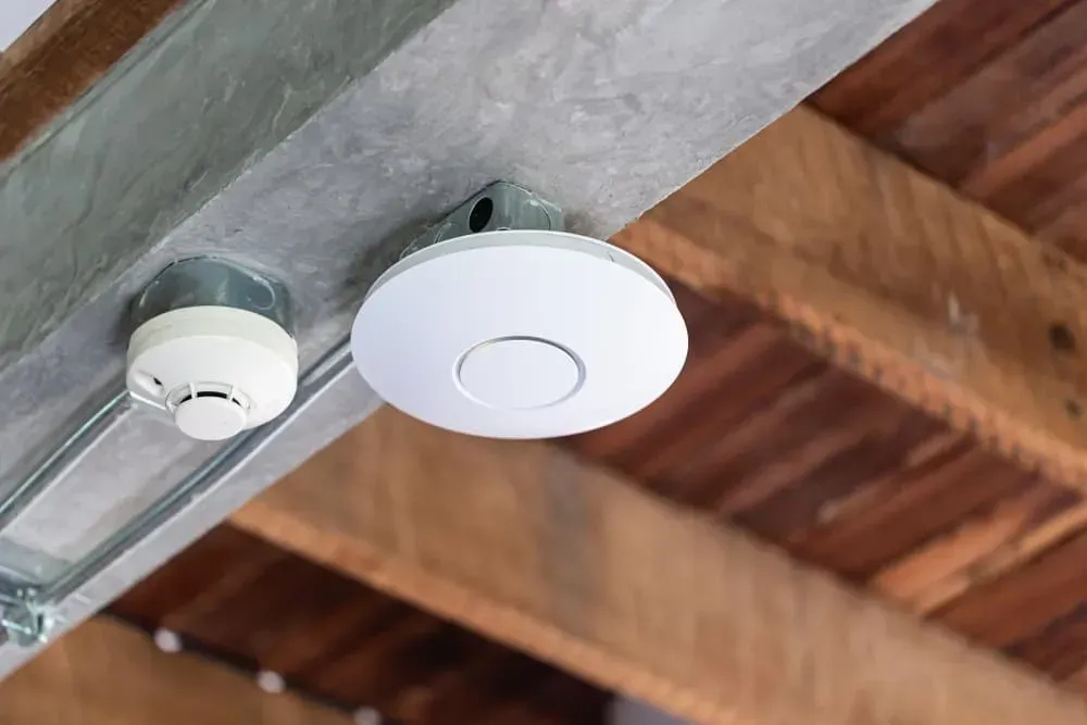 A White Smoke Detector and a Circular Wi-fi Access Point — CH Electrics in Emerald, QLD