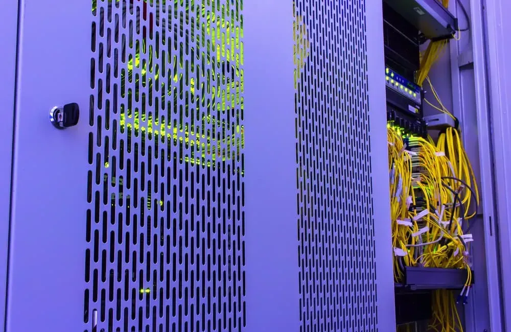 A View of a Partially Open Server Rack With Visible Networking Hardware — CH Electrics in Emerald, QLD
